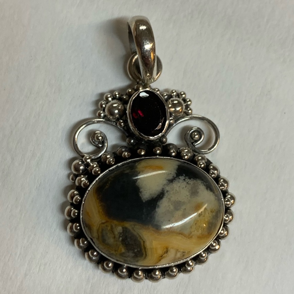 Beautiful stone with a sparkly genuine garnet pendant ONLY